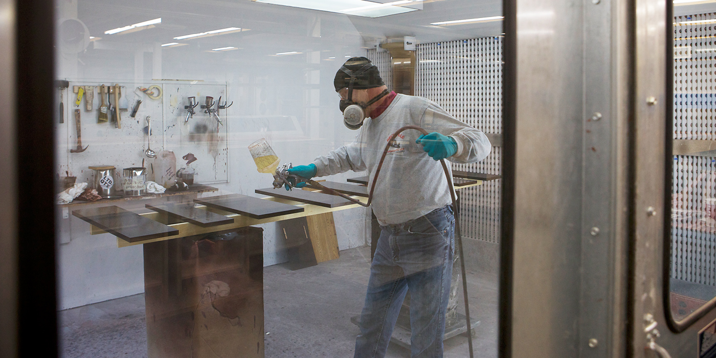 Worker uses a respirator in a workshop